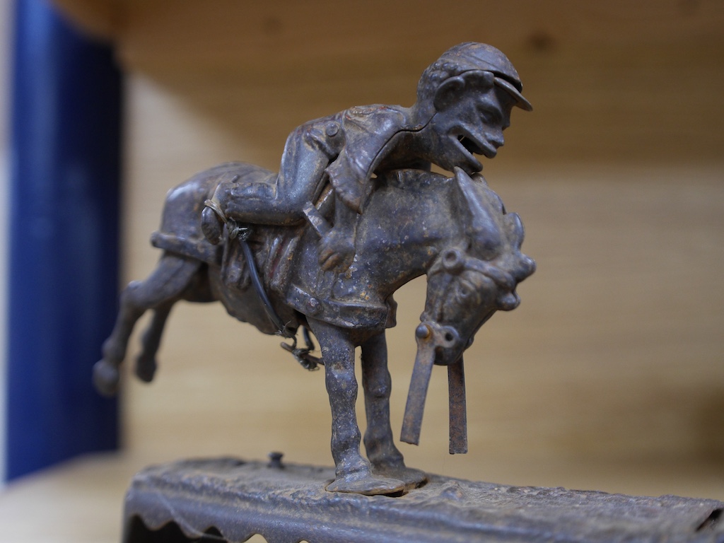 An American novelty cast iron money bank, ‘Always did ‘spise a mule’, 25cm wide. Condition - poor to fair